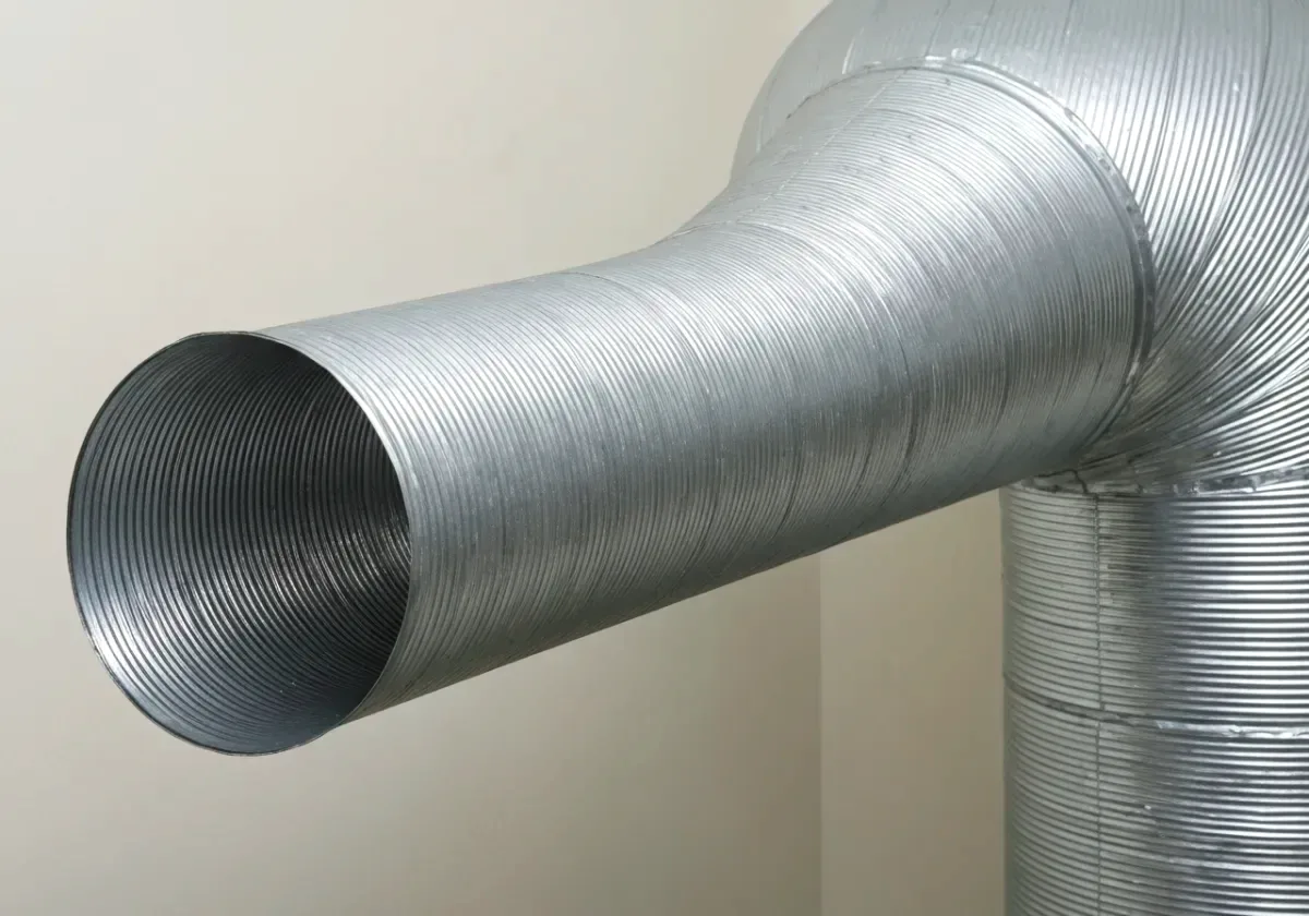 After — dryer vent cleaning: A lint-packed vent run cleared end to end, airflow verified at the hood.